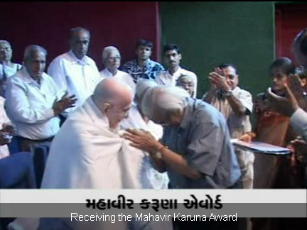 Receiving the Mahavir Karuna Award
